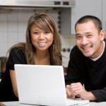 Couple using laptop